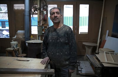 Carpenter Mohammad Reza Tajik at his workshop in northern Tehran, Iran. AP