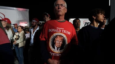 People listen as President Donald Trump speaks at a rally at Harrisburg International Airport after announcing Amy Coney Barrett as his choice to be the new Supreme Court justice. AFP