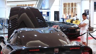 A car enthusiast admires a Viper supercar featured in the movie Fast and Furious 7. Pawan Singh / The National