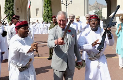 King Charles, then Prince of Wales, takes part in a traditional Omani sword dance outside the Sultan's Palace in November 2016. Getty
