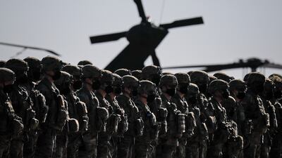 US soldiers on parade during the visit of Nato Secretary General Jens Stoltenberg to the Mihail Kogalniceanu airbase, near Constanta, eastern Romania. AP