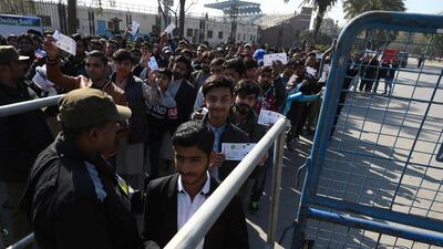 Spectators outside the Gaddafi Stadium in Lahore. AFP