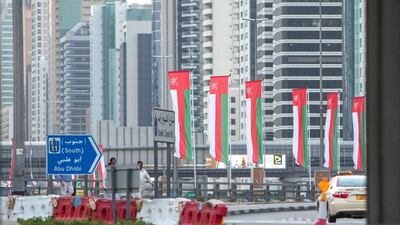Dubai, United Arab Emirates- Omani flags on display at Sheikh Zayed Road roundabout. Leslie Pableo for The National