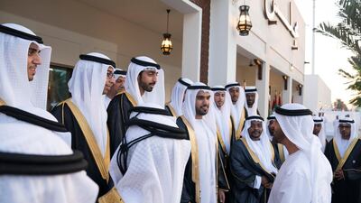 Sheikh Mohamed bin Zayed speaks with grooms during a mass wedding held at Majlis Al Manhal. Hamad Al Kaabi / Ministry of Presidential Affairs