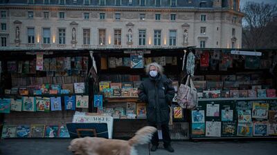 Fancis, who celebrates working as a Bouquiniste for forty years this year, stands in front of his book stall in Paris, France. The open-air booksellers have been hit hard by the coronavirus. Getty Images