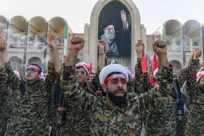 Basij members and Shiite clerics participate in a farewell ceremony ahead of the funeral procession. Getty Images
