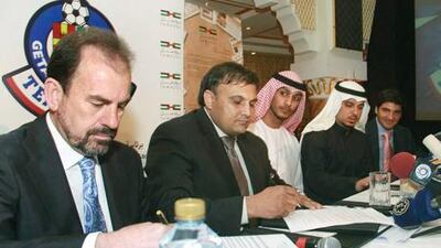 Spanish club Getafe president Angel Torres, Royal Emirates Group of Companies managing director Kaiser Rafiq and Dubai's Sheikh Butti bin Suhail al Maktoum sign purchase agreements.
