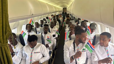 The Gambia national team aboard a plane in Banjul, Gambia, on Wednesday. The chartered flight had to make a emergency landing soon after takeoff. The players were able to travel to Ivory Coast on Thursday. AP