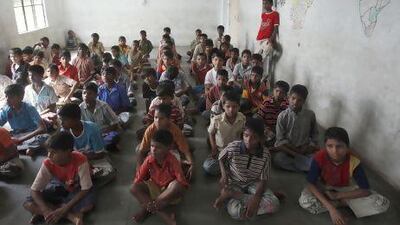 Children watch television at an orphanage in Hyderabad. Child abuse is still common in India, despite efforts to stamp it out.