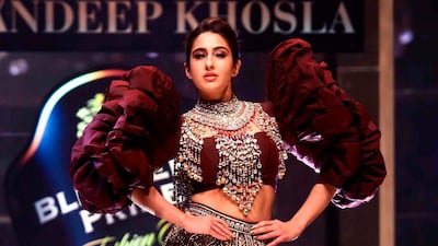 And not at Lakme in Mumbai, but over in Delhi, Sara Ali Khan presents a creation of designers Abu Jani and Sandeep Khosla during the Delhi chapter of the Blenders Pride Fashion Tour 2019-20 in New Delhi. AFP