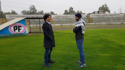 Roberto Kettlun, sports manager for Deportivo Palestino, speaks with coach Sebastian Mendez. Juman Jarallah / The National