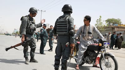 Afghan police officers secure the site of a car bomb blast in Kabul, Afghanistan, August 7, 2019. REUTERS/Omar Sobhani
