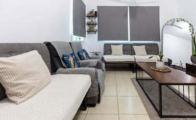 The light and bright lounge area of the apartment. Chris Whiteoak / The National