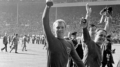 England captain Bobby Moore shows off the Jules Rimet trophy with teammates Gordon Banks and George Cohen at Wembley. PA