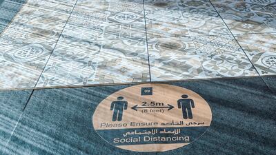 Social ditancing sign at 99 Sushi Bar and Restaurant, Four Seasons Hotel, Abu Dhabi. Victor Besa / The National