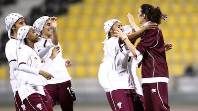 Helena Costa, right, while coach of the Qatar national women's football team. AFP Photo / HO / Qatar Olympic Committee