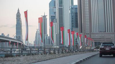Omani flags on display at Sheikh Zayed Road roundabout. Leslie Pableo for The National
