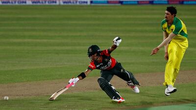 Australia's Mitchell Starc tries to run Bangladesh's Afif Hossain out,