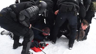 Police in St Petersburg, Russia, detain men during a rally in support of jailed opposition leader Alexei Navalny. AFP
