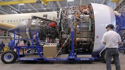 An Airbus employee working on a Rolls-Royce Trent XWB engine for the A350 MSN1 aircraft. Rolls has pushed back salary rises. Guillaume Horcajuelo / EPA