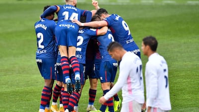 Huesca players celebrate after Javi Galan put them 1-0 up. AFP