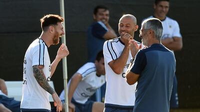 Lionel Messi, left, laughs before training with the Argentina national team at the San Jose State University. Mark Ralston / AFP