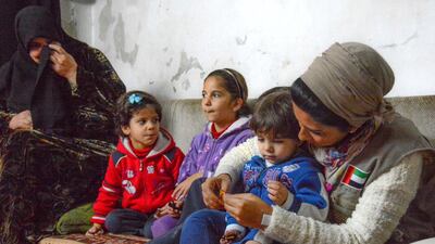 Shaima Al Zarooni, chief executive of International Humanitarian City, meets Syrian refugees in Jordan. Courtesy UNHCR