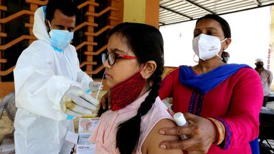 Indian medical personnel collects swab samples in Bhopal, India, 7 September. Sanjeev Gupta/ EPA