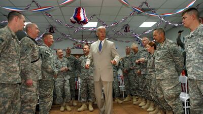 U.S. Vice President Joe Biden talks with soldiers at Camp Victory on the outskirts of Baghdad, Iraq July 4, 2009. Reuters