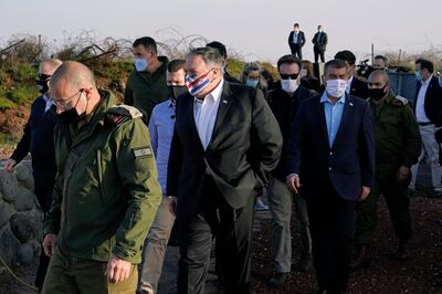 Secretary of State Mike Pompeo, centre, arrives for a security briefing on Mount Bental in the Israeli-controlled Golan Heights. AP