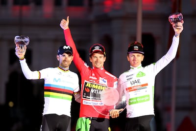 Tadej Pogacar, right, after finishing third in the 2019 Vuelta behind champion Primoz Roglic, centre, and second-placed Alejandro Valverde. EPA
