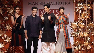The Indian fashion designer Manish Malhotra, second from left, at Wills Lifestyle India Fashion Week in New Delhi. IANS