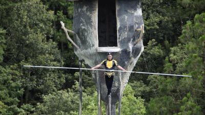 Askar Obulqasim walks on a tightrope during a show at a theme park outside Kunming in southwest China’s Yunnan province. Helene Franchineau / AP Photo