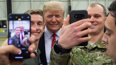 US President Donald Trump greets members of the US military during a stop at Ramstein Air Base in Germany. AFP