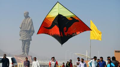 An Australian participant flies a kite decorated with an image of a kangaroo. AFP