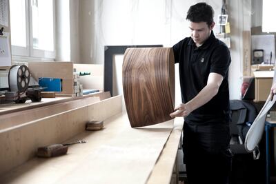 A sheet of veneer that will be shaped into the rim of a grand piano at Steinway’s Hamburg factory. Photo: Steinway & Sons