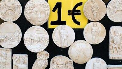 Even if it Greece abandons the euro zone and reverts to the drachma, it would be left with unsustainable debts in a strong currency. Vladimir Rys / Getty Images