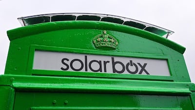 The first traditional London telephone box to be transformed into a solar-powered mobile phone charger for use by the public, is pictured in central London (AFP PHOTO/CARL COURT)