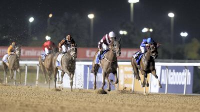 Al Hayette, centre, ridden by Fabrice Veron, wins the Azizi Mina at Meydan Racecourse in Dubai on Thursday night.