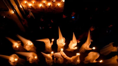 Penitents take part in a Holy Week procession in Verges, northeastern Spain. Pau Barrena / AFP Photo