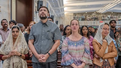 People at St Michael’s Catholic Church in Sharjah. Some churches introduced precautionary measures for the huge congregations. Ahmed Ramzan / The National