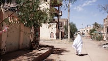 A woman walks in Omdurman, Sudan on November 1, 2024. Sudanese politicians have accused Tehran of supporting armed Islamists in the war-torn country. EPA