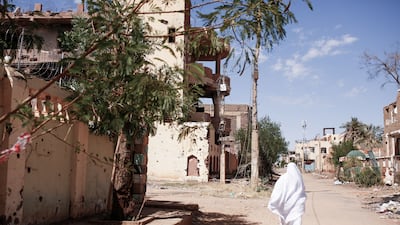 A woman walks along a street in Omdurman, Sudan, on November 1, 2024. If peace does return, Sudan’s future should be that of a modern state, not a battleground for militias or ideological projects. EPA