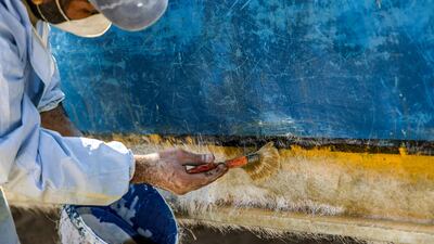 It is then applied to the boats with a brush