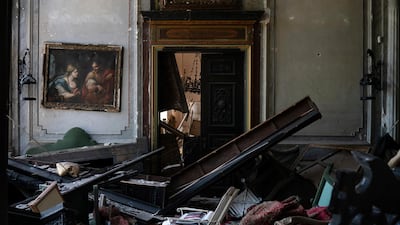 A painting hangs on the wall of a heavily damaged room in the Sursock Palace. AP Photo