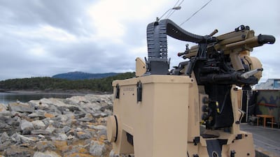 A remotely operated machine gun is seen next a temporary military base in Stjordal, Western Norway. AFP