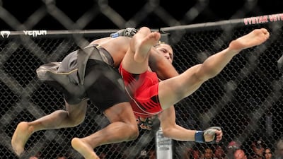 Kamaru Usman throws down Jorge Masvidal. Getty