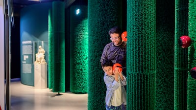 Visitors listen to the voices of the forest, which lead them into the maze of Sleeping Beauty’s thorn hedge at Grimmwelt Kassel. Photo: Grimmwelt Kassel