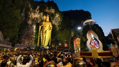 Giant Kavadi offering cages are carried by Hindu devotees in a procession during the Thaipusam festival at Batu Caves, outskirts of Kuala Lumpur. AP Photo