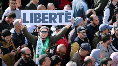 Demonstrators carry banners and gesture during a protest rejecting the presidential election in Algiers, Algeria. REUTERS